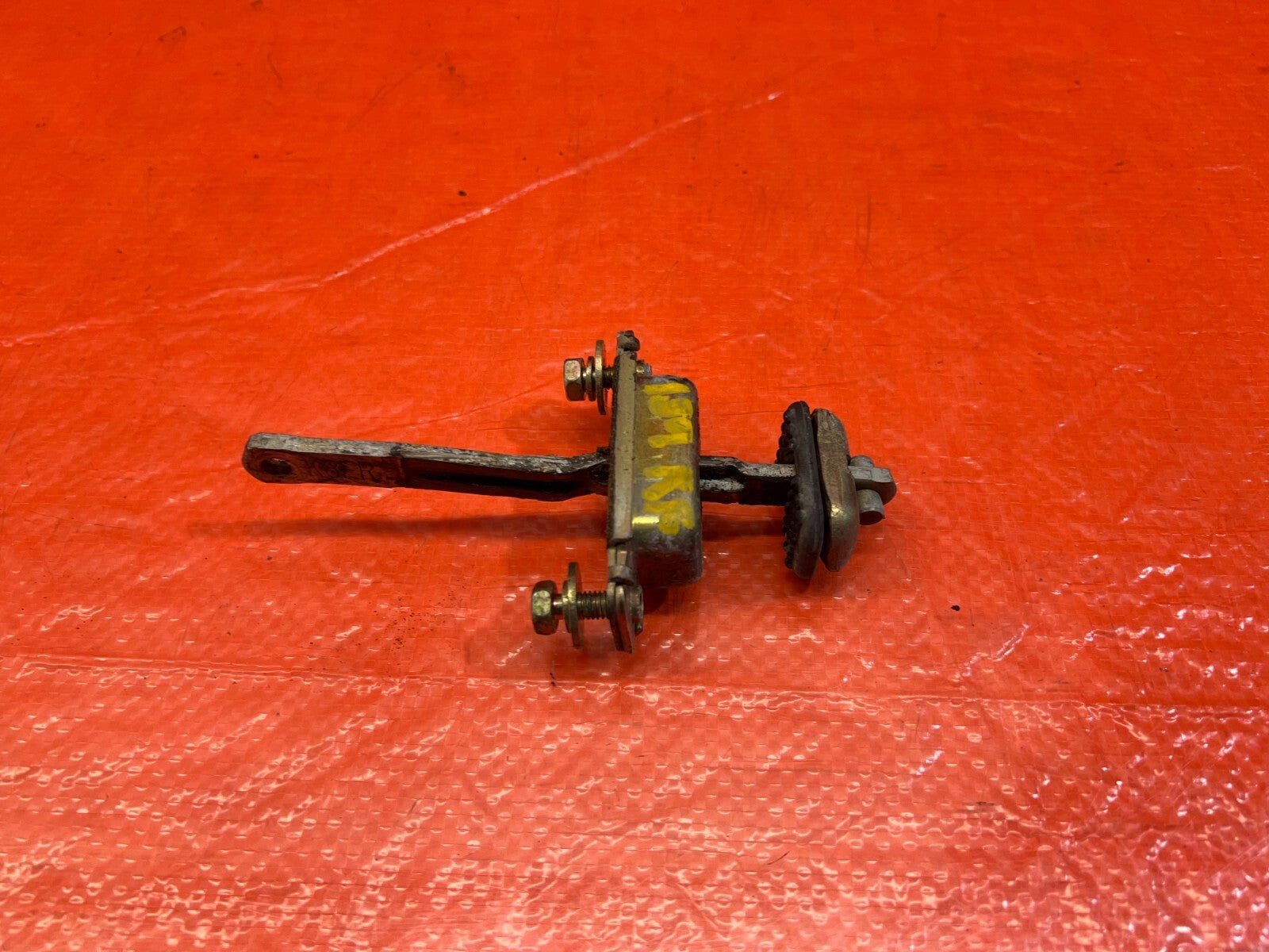 90 96 ACURA INTEGRA SEDAN   LEFT OR RIGHT FRONT DOOR CHECKER HINGE ARM STOPPER  0