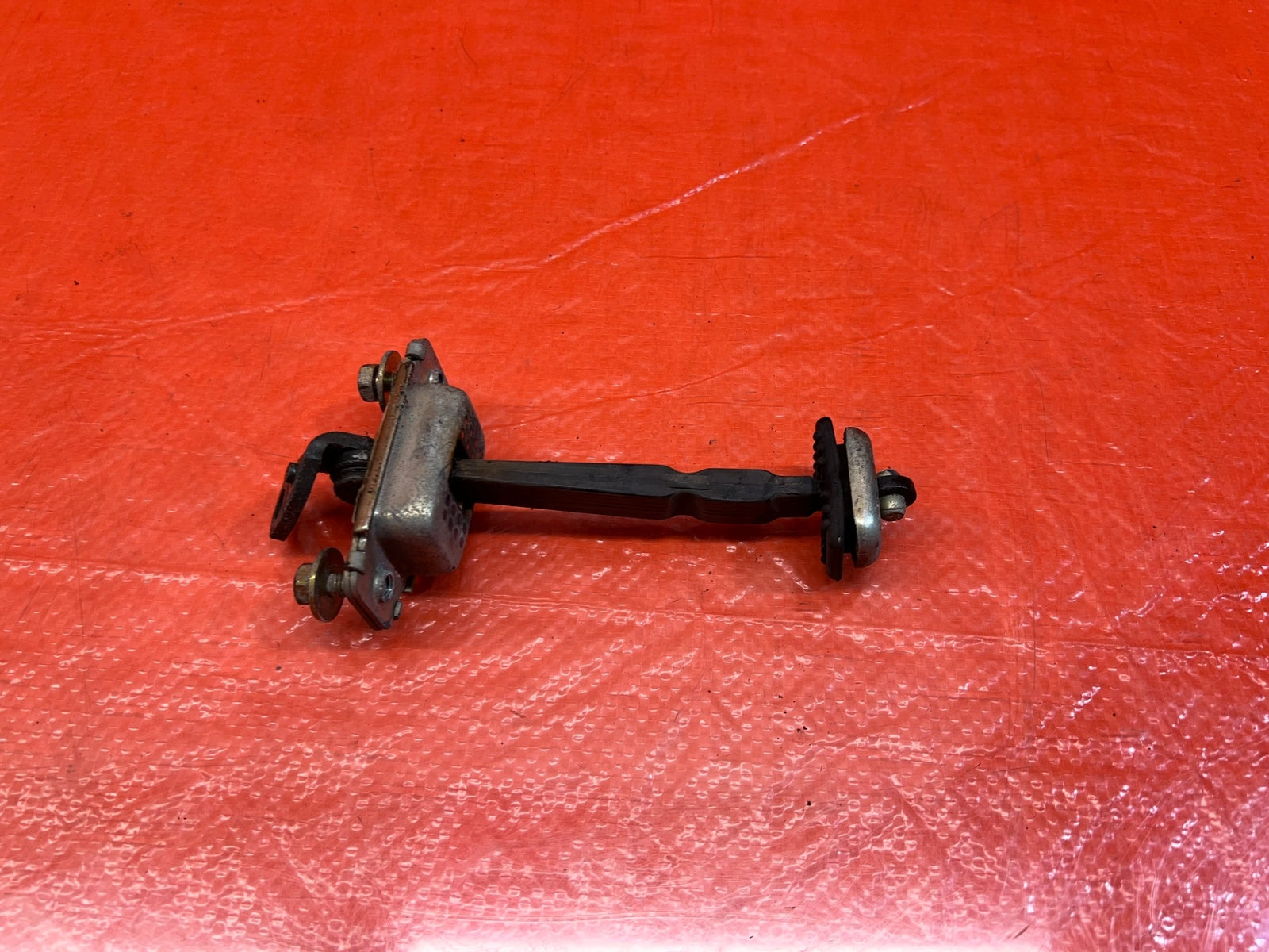 98 02 HONDA ACCORD SEDAN   PASSENGER REAR DOOR CHECKER HINGE ARM STOPPER OEM 1679