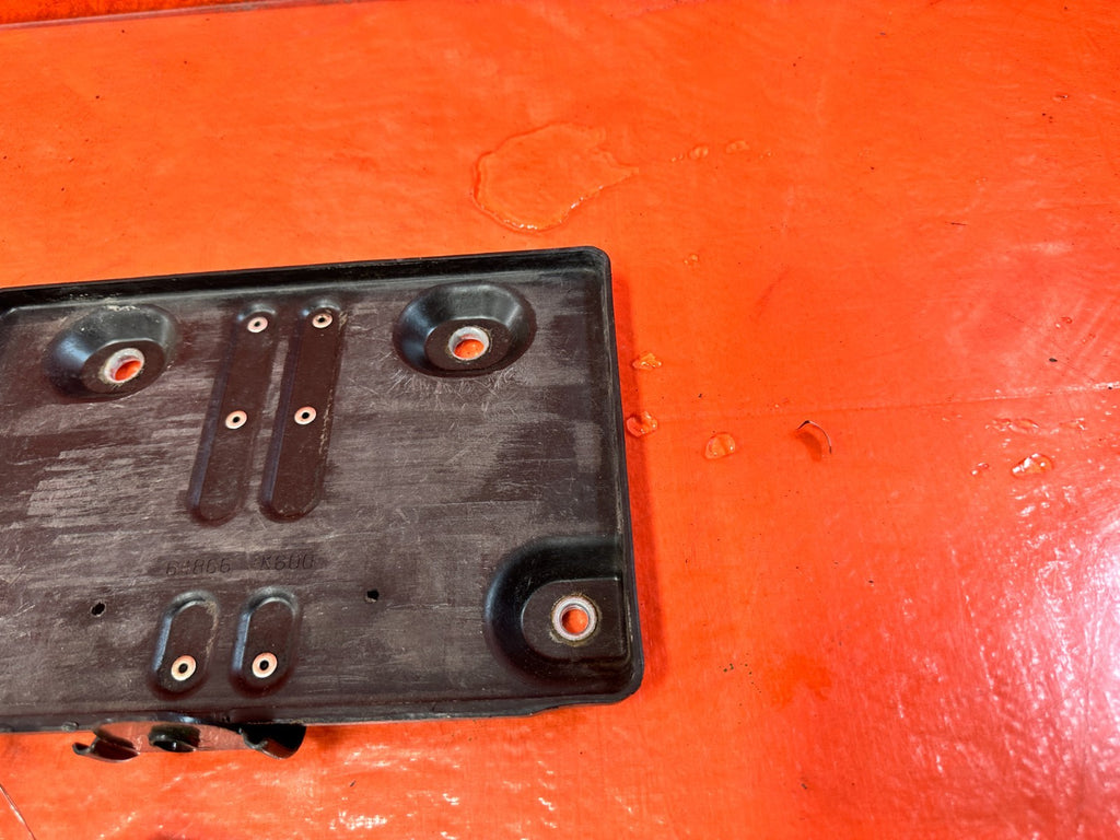 08 15 INFINITI G37 & Q60   2D   BATTERY TRAY MOUNTING BRACKET W/ TIE DOWN COVER2