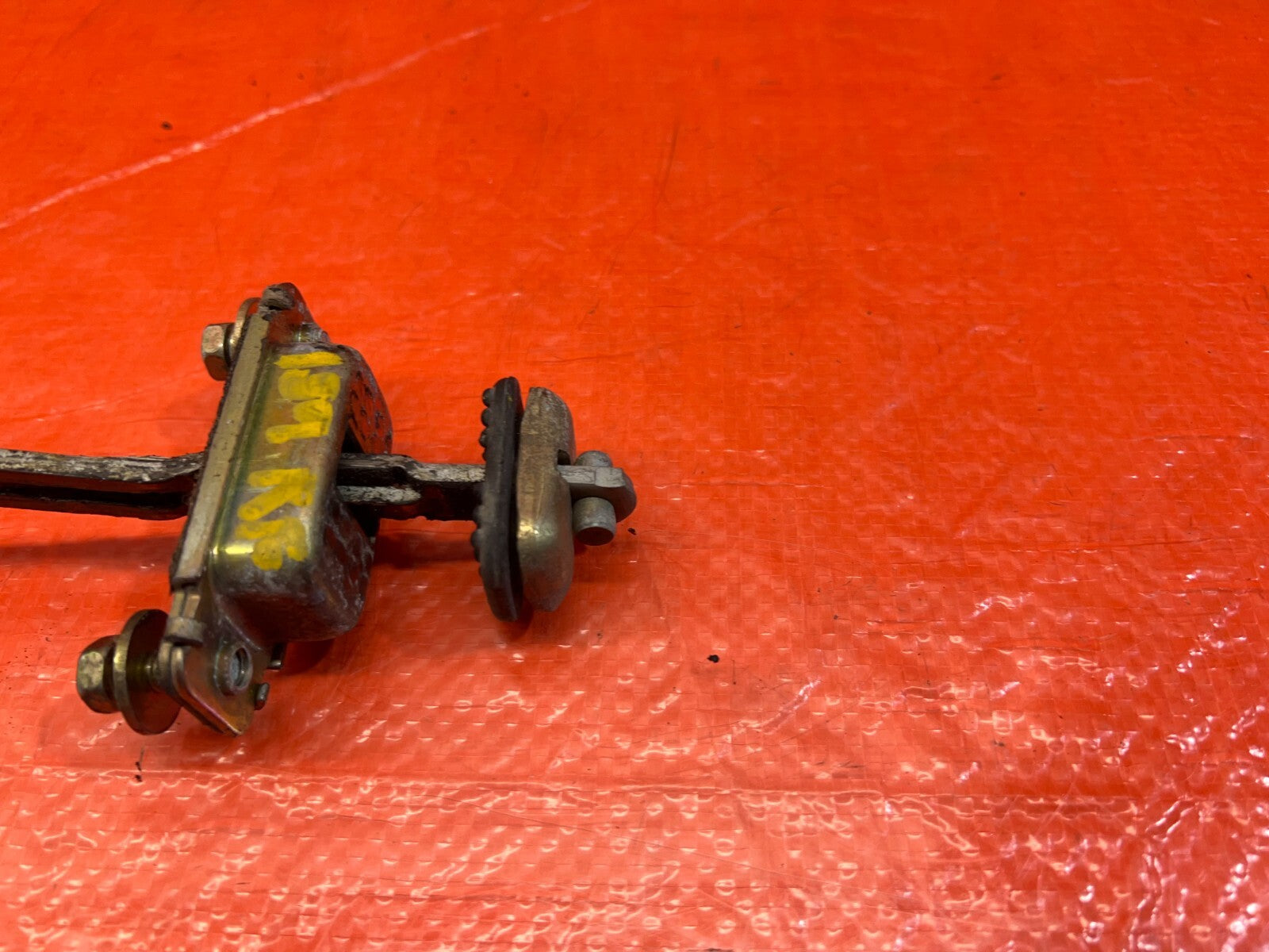 90 96 ACURA INTEGRA SEDAN   LEFT OR RIGHT FRONT DOOR CHECKER HINGE ARM STOPPER  4