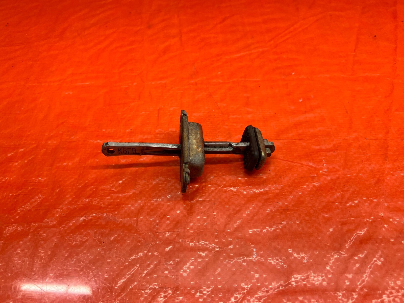 90 96 ACURA INTEGRA SEDAN LEFT OR RIGHT FRONT DOOR CHECKER HINGE ARM STOPPER 1654