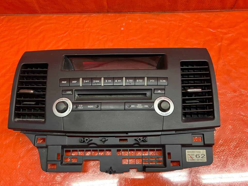 12 13 LANCER EVOLUTION X EVO 10   5 SPEED   RADIO STEREO FACE PLATE   OEM #1779